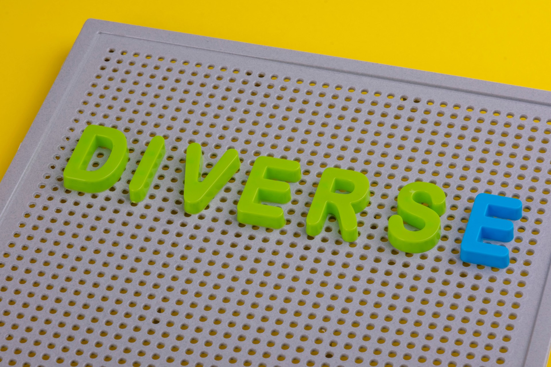 DIVERSE word composed with colorful abc alphabet letters, copy space